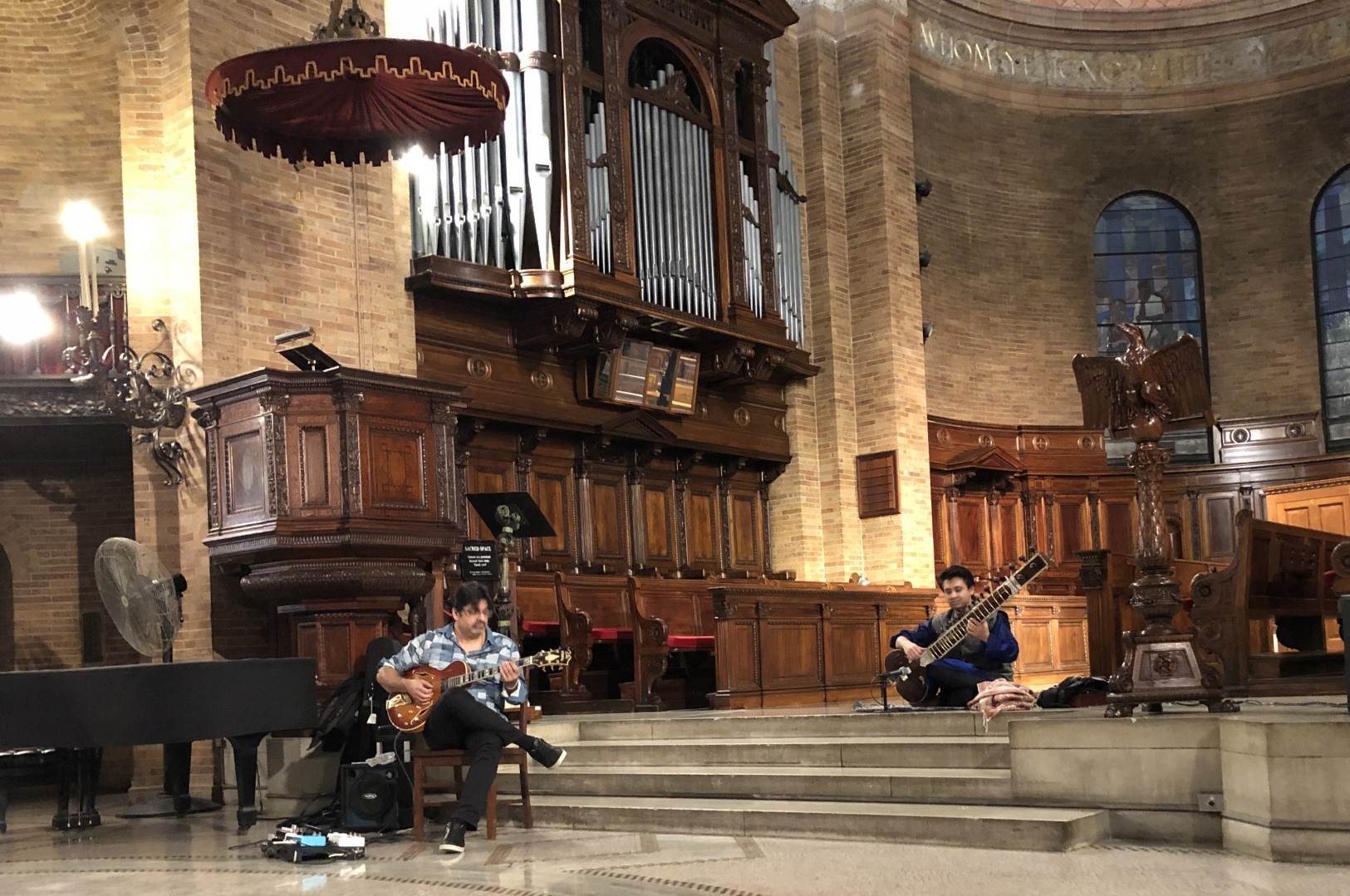 Sacred music event at St. Paul's with a sitar and guitar player. 